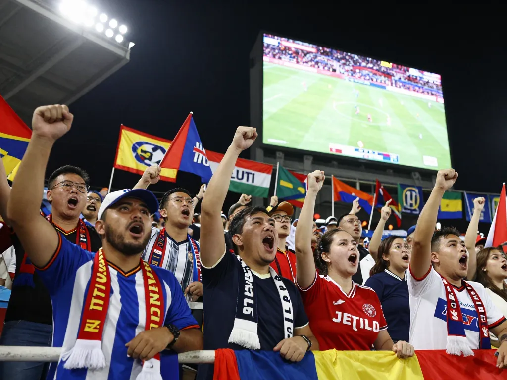 Excited football fans watching live scores on Nowgoal during a match in a vibrant stadium.